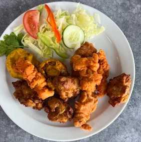 crispy pakoras with salad on a plate served at Tartan Tikka Tikka Alloa